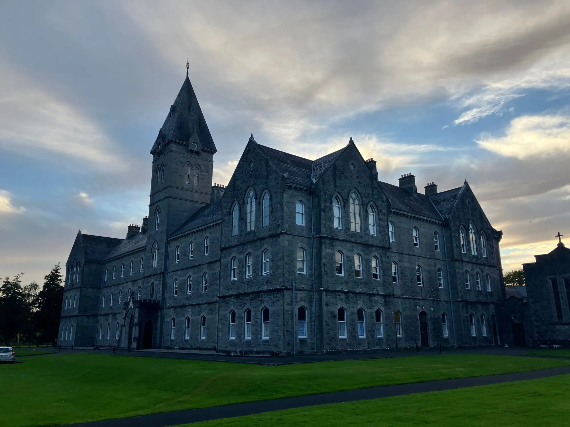 Large stone meditation seminar building at dusk