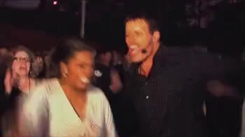 Oprah doing the Fire Walk at UPW with Tony Robbins